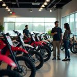 A range of Stark electric dirt bikes displayed in a dealership showroom, offering a variety of models for different off-road riders.